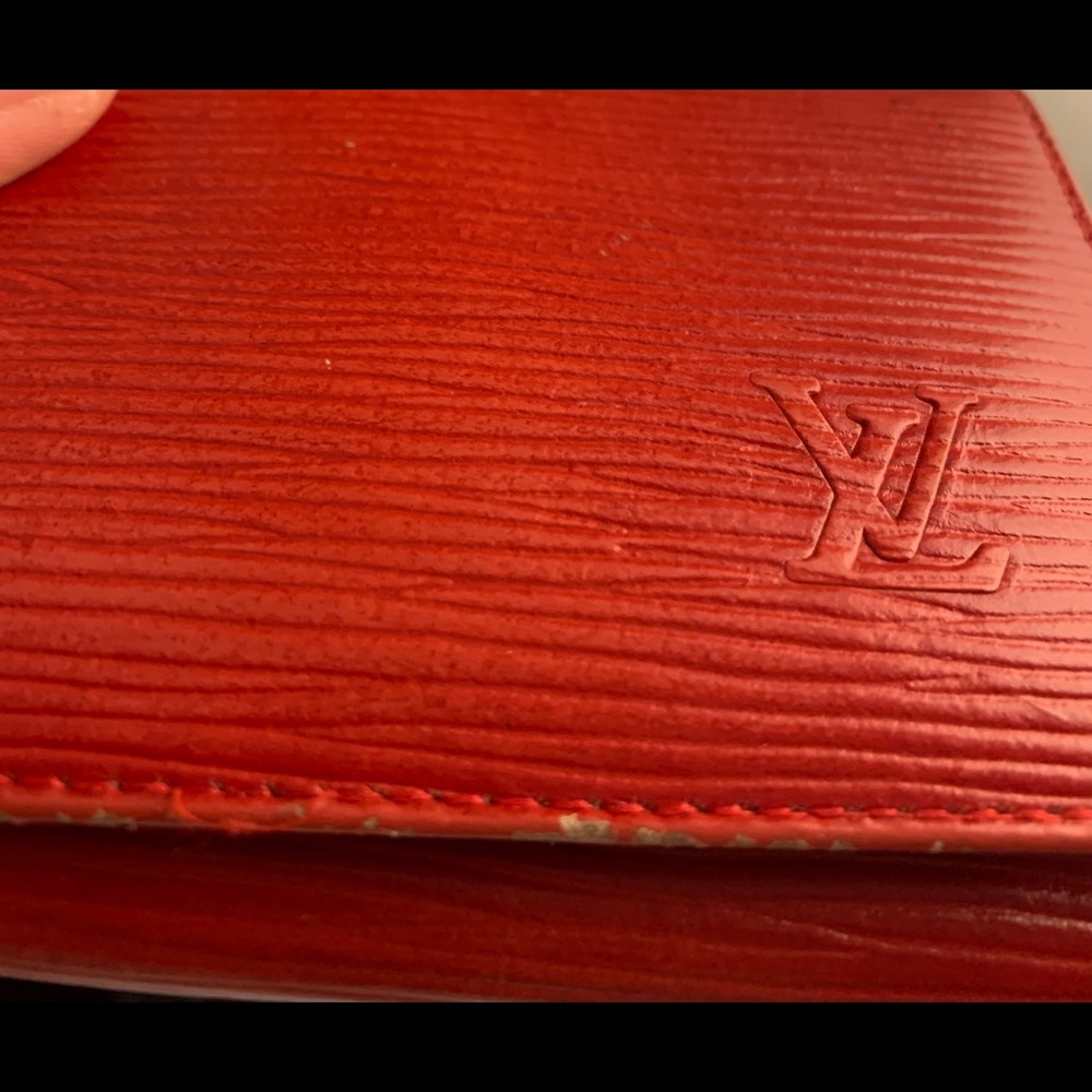 LV epi leather bifold woman’s red wallet.